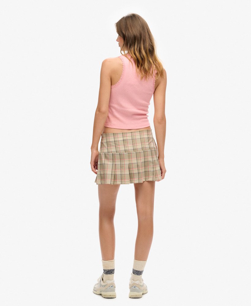 rok met halve plooien en ruitpatroon in crème en marineblauw.