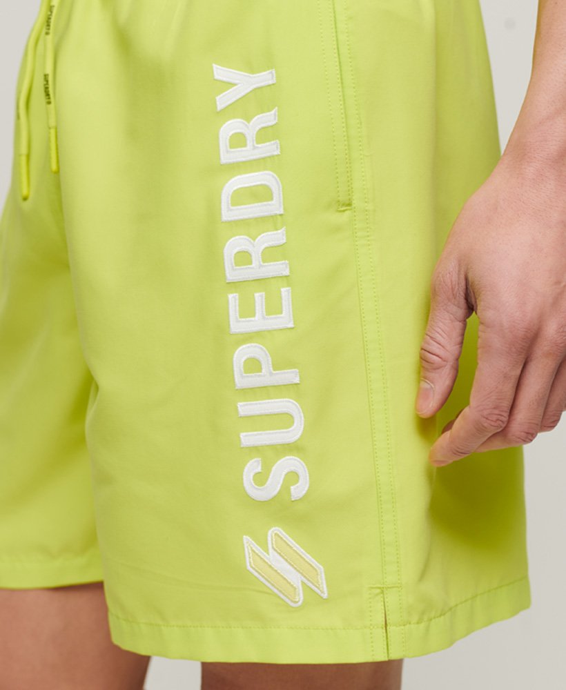gerecyclede zwemshorts met applicaties van 48 cm in de kleur electric lime.