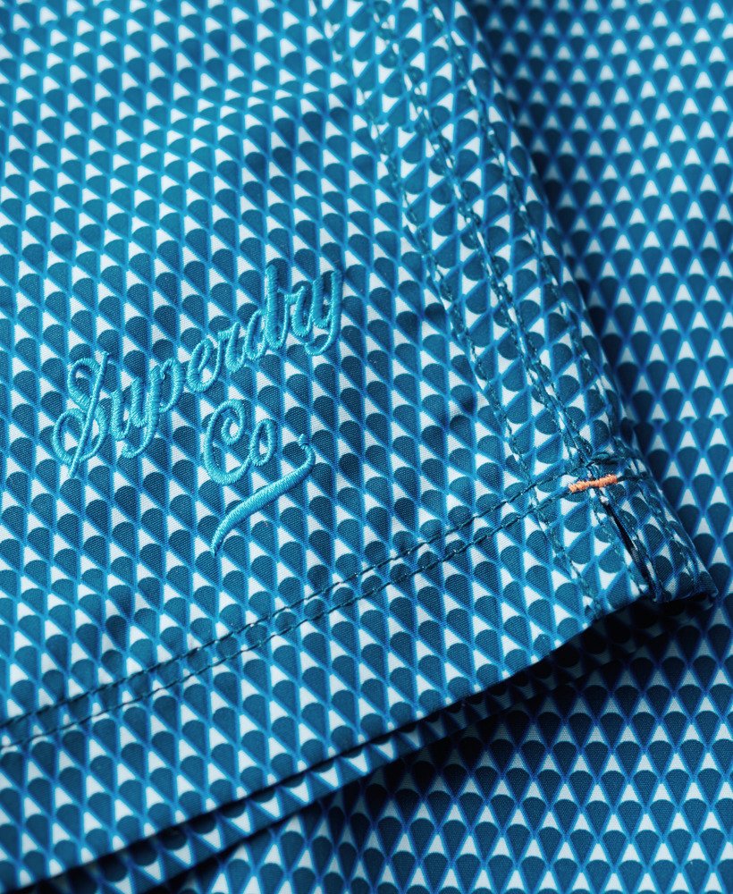 bedrukte gerecyclede zwembroek van 38 cm met blauwe geometrische print.