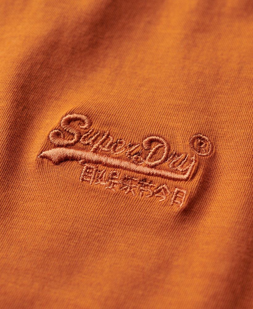 t-shirt van biologisch katoen met geborduurd essential-logo in mojave-oranje.