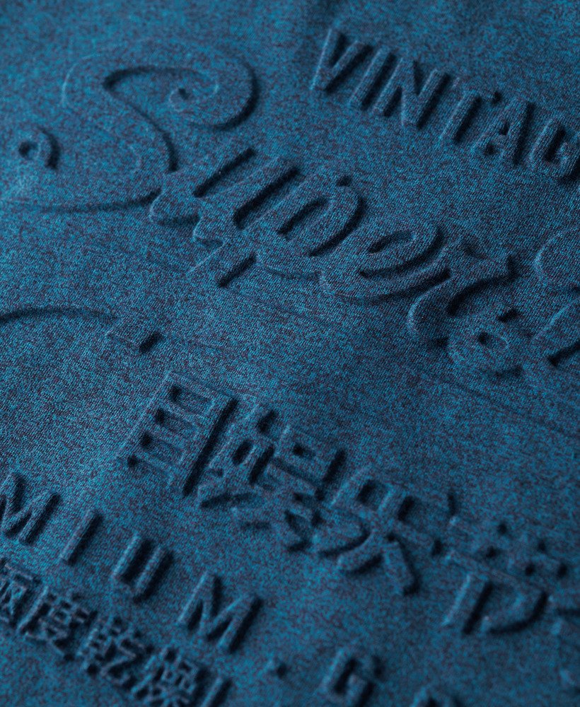 t-shirt met reliëfprint in verkoolde turquoise tint.