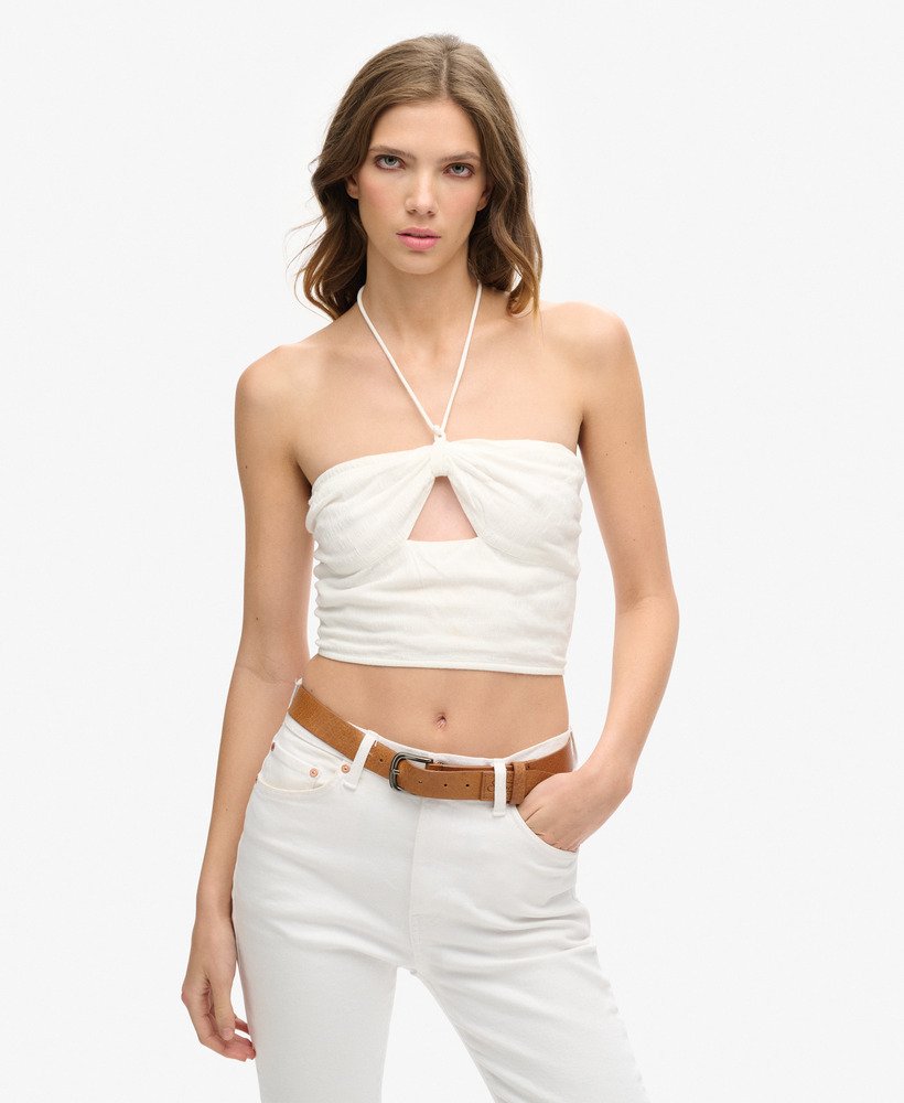 cropped top met uitsnijdingen van geweven materiaal in gebroken wit.
