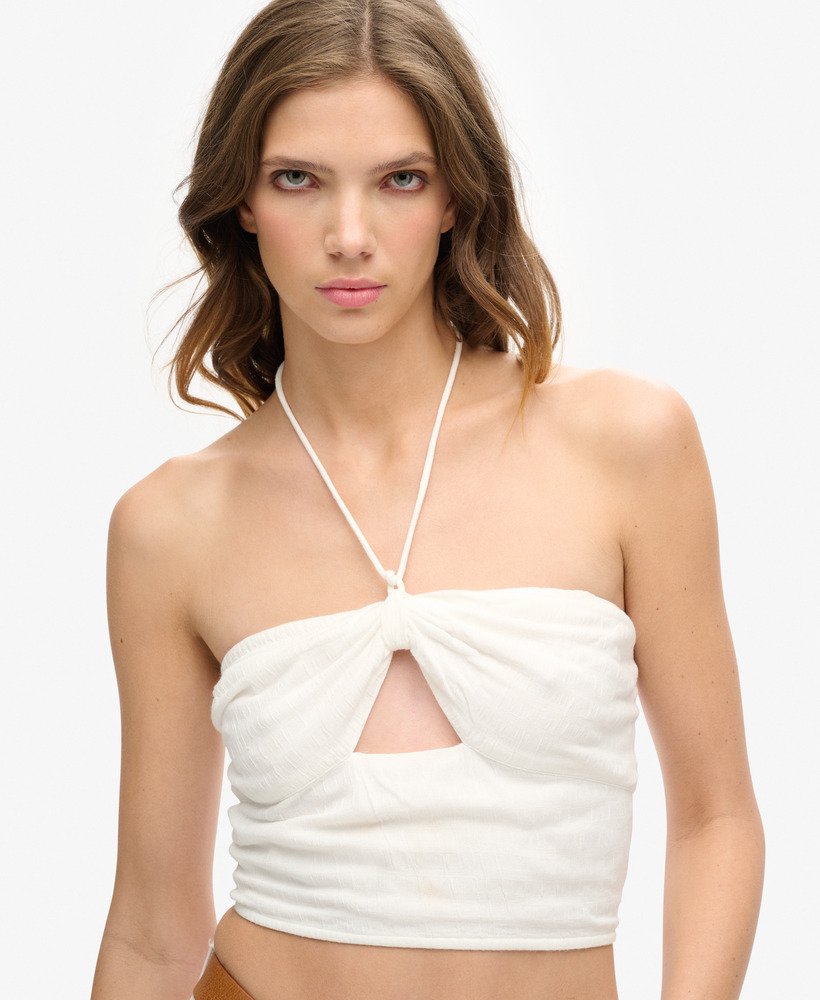 cropped top met uitsnijdingen van geweven materiaal in gebroken wit.