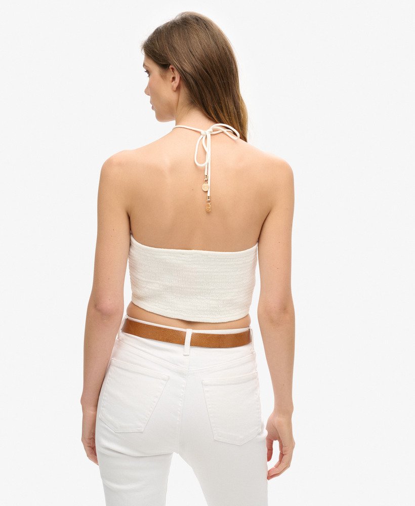 cropped top met uitsnijdingen van geweven materiaal in gebroken wit.