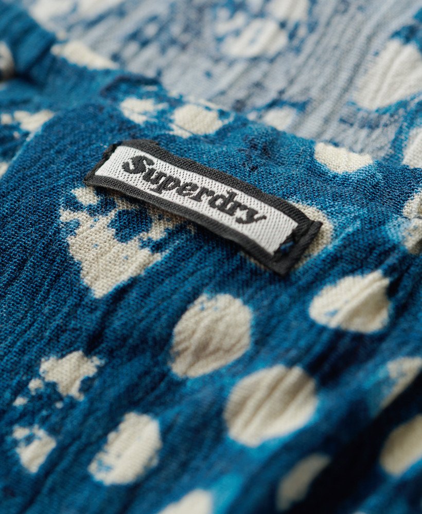 bedrukte haltertop voor op het strand met shibori blauwe rand