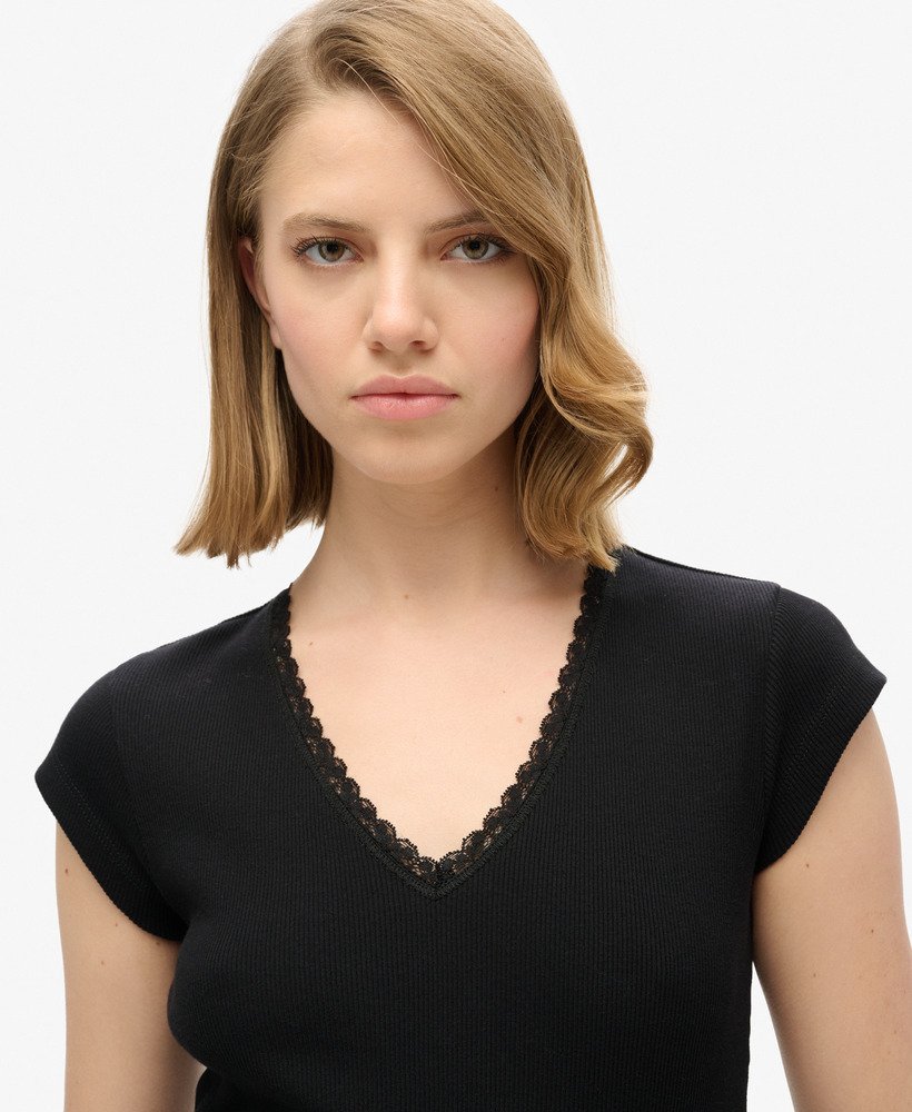 athletic essentials top met v-hals en kanten afwerking in zwart