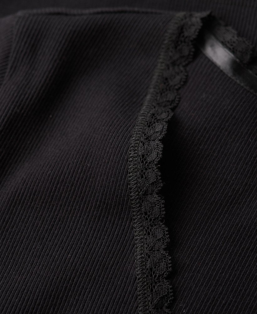 athletic essentials top met v-hals en kanten afwerking in zwart