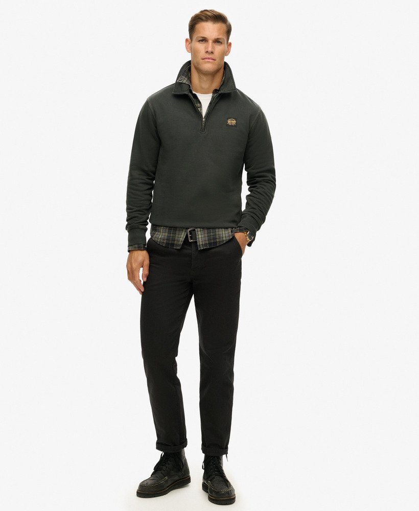top met halve ritssluiting en contrasterende stiksels in gewassen zwart.