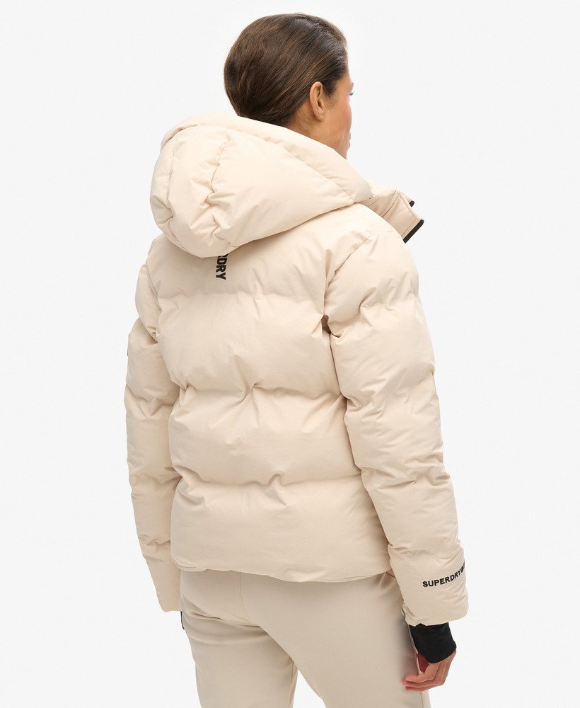 boxy gewatteerde ski-jas met capuchon in gebroken grijs.